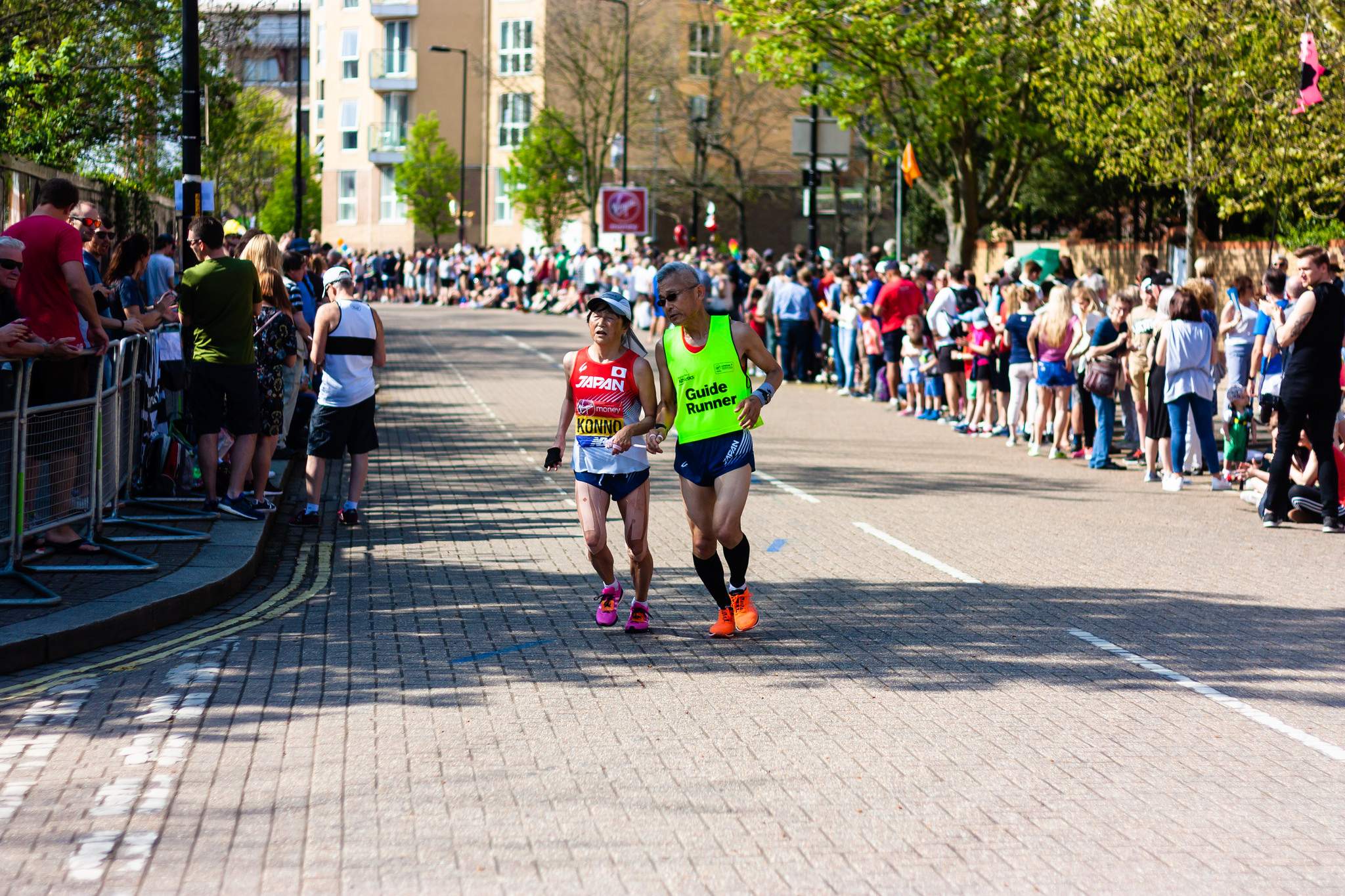 Visually impaired runner from Japan accompanied by her guide runner, 2018 London Marathon