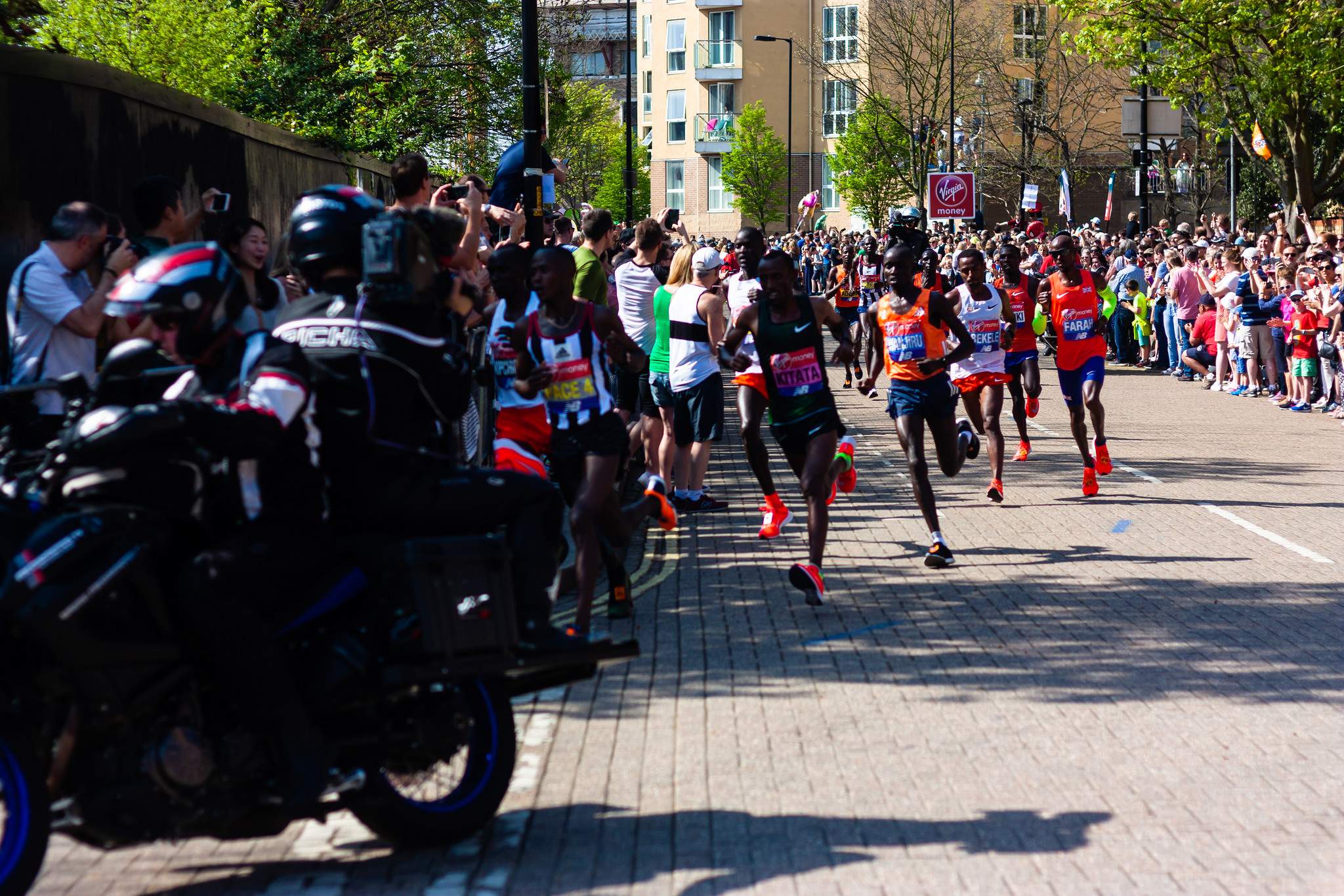 Elite runners: Tola Shura Kitata, Daniel Wanrjiu, Kenenisa Bekele, Mo Farah on the course of 2018 London Marathon